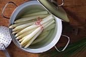 Boiled white asparagus in a pot