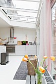 A light kitchen with a glass roof