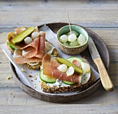 Open ham sandwiches with cucumber and pearl onions