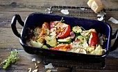 Oven-roasted vegetables with ham and flaked almonds