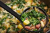 Green kale soup with potatoes, beans and chorizo (Portugal)