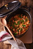Veal goulash with parsley in a braising pot