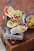 Vegetarian tortilla wraps filled with beans, lettuce and cheese