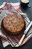 Spicy cauliflower cake with cress on a cooling rack