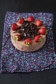 Chocolate cheesecake with fresh strawberries and chocolate curls