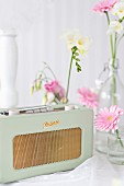 Vintage-style radio and flowers decorating buffet table
