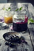 Jars of blackcurrant jam and gooseberry jam