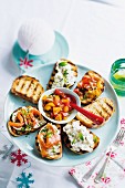 Various types of bruschetta with a dip for Christmas