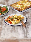 Oven-roasted potato omelette with feta cheese and a tomato and rocket salad