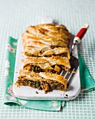 A puff pastry pie filled with a lentil ragout, pumpkin and spinach