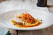 Mahi in a caper and lemon sauce with carrots and onions