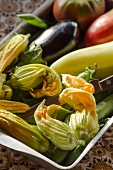 Fresh summer vegetables and courgette flowers