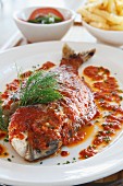 Baked fish in tomato sauce