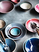 Various ceramic bowls and cutlery