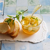 Homemade pear jam with white wine and fresh mint