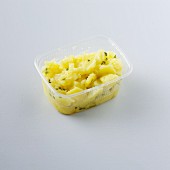 Potato salad with a vinegar and oil dressing as a takeaway