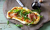 Rocket and mozzarella pizza with Parma ham