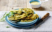 Thick pancakes with green asparagus and tarragon