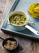 Savoy cabbage stew with rice, pineapple, mango and hazelnuts