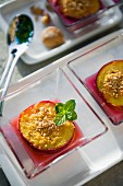 Steamed peaches with ground almond and peppermint