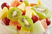 Fruit salad with melon, grapes and kiwi slices