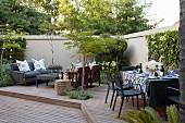 Set table and lounge area on courtyard terrace