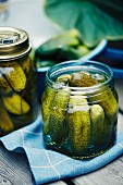 Salted gherkins in screw-top jars