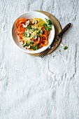 Vegan carrot noodles with a red lentil and cashew nut sauce