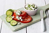 Coarse cream cheese with chives with tomatoes and cucumbers