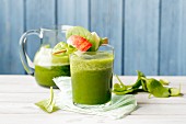 A vegan spinach smoothie made with bananas and kohlrabi leaves