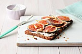 Wholemeal bread topped with ricotta, almond mousse and fresh figs