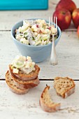 Herring salad with apple, leek, onions and sour cream