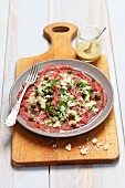 Beef carpaccio with mustard dressing, capers and Parmesan cheese