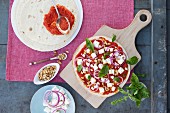 Vegetarian feta pizza with ajvar and pine nuts