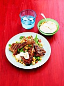 Marinated lamb chops with spicy yoghurt and chickpea salad