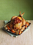 Roast chicken with bacon and a side of vegetables