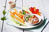 Vegetable sticks with a red pesto dip