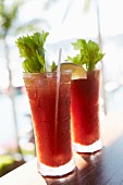 Two Bloody Mary's at a beach bar
