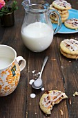 Almond biscuits with icing sugar and milk
