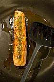 Fried salmon in a pan