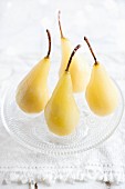 Poached pears on a glass plate