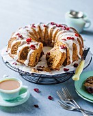 A carrot wreath cake with cranberries and cinnamon