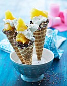 Ice cream cones with pineapple and cream