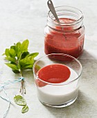 Vegan panna cotta made from coconut milk with strawberry sauce