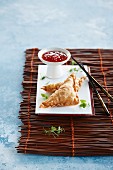 Won tons with asparagus and chilli sauce (Asia)