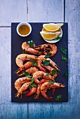 Fried prawns with parsley and lemons
