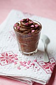 Chocolate mousse decorated with pink sugar hearts