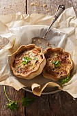 Spicy mini quiches with cheese and parsley