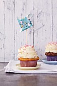 A pinwheel decorating a cupcake