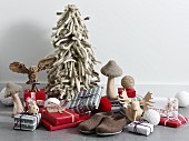 Presents, felt slippers and stylised Forest decorations: a wooden moose and a wooden owl, mushrooms and a Christmas tree made from thick wool